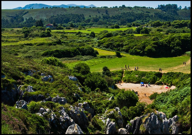 Nestled in the Asturian hills, Playa de Gulpiyuri offers a secluded retreat, hidden from the bustling coast.