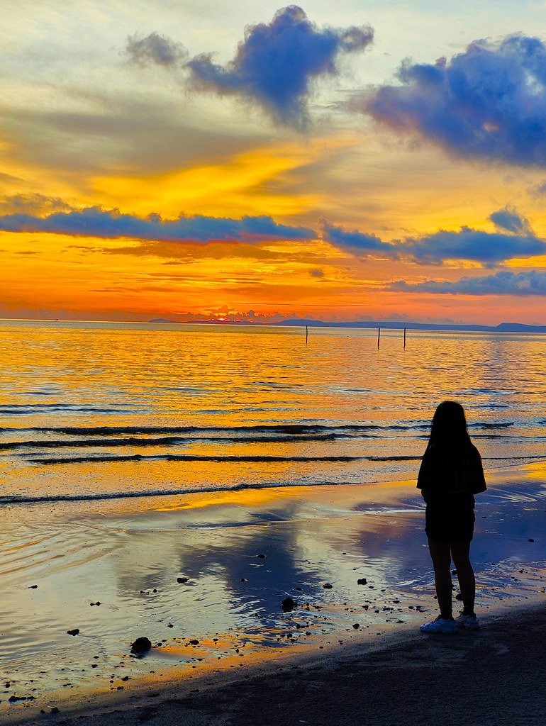 Experience the serenity of Sunset Beach on Koh Rong Sanloem, where vibrant sunsets paint the sky.