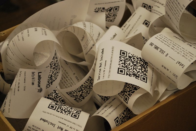 Close-up of receipts provides a visual of expenses but lacks vibrancy.
